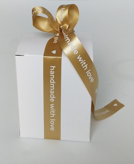wwhite box with gold ribbon
